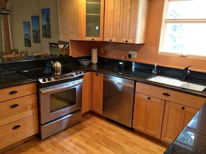 Fully equipped kitchen with stainless steel appliances.