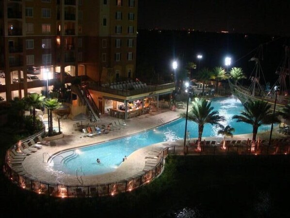 Enjoy a drink at the bar while relaxing around the pool.