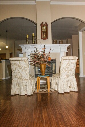 Small Formal living area in front of fireplace