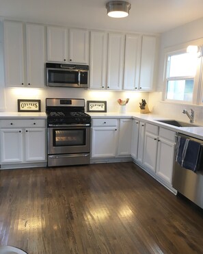 Full kitchen with modern upgrades including stainless steel appliances.