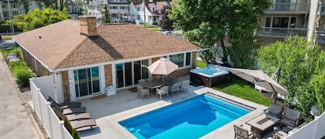 Brand new pool, hot tub, fire pit and backyard area right next to the beach!  