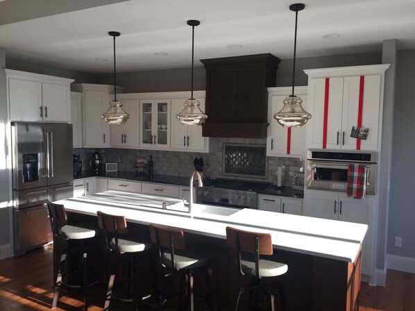 Gourmet Kitchen with commercial grade stainless steel appliances. 