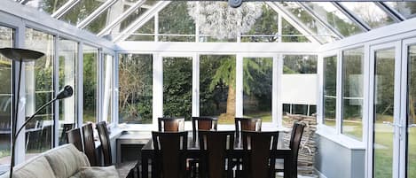 Conservatory with a dining table