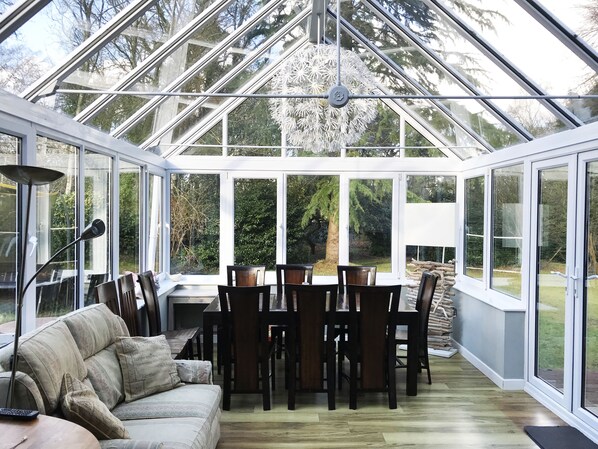 Conservatory with a dining table