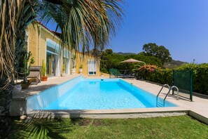 Villa and pool seen from the garden