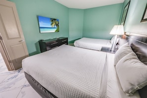 - Comfortable bedroom includes a queen size bed & a full size bed for added convenience - Unwind with your favorite shows on the mounted smart TV in a cozy, serene atmosphere - Perfect space for friends & family to enjoy a relaxing getaway by the beach