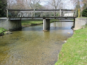 stream and bridge across street