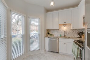 The kitchen features lots of natural light