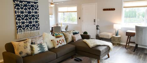 spacious living room with tasteful decor and upscale furniture