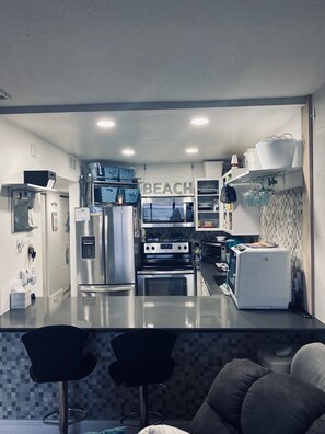 Kitchen and breakfast bar