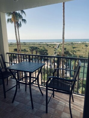 Balcony  table & 2 chairs . Beach chairs & umbrella …ect inside balcony closet.