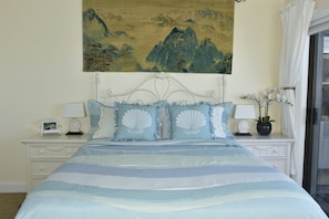 Master Bedroom - Comfortable queen bed with a touch of beachside charm.