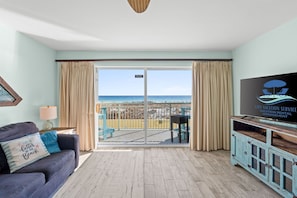 Living Area - Balcony Access - Sleeper Sofa - Ocean and Pool View - Cable & Smart TV - Dining Area