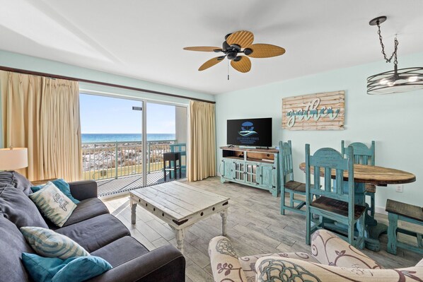 Living Area - Balcony Access - Sleeper Sofa - Ocean and Pool View - Cable & Smart TV - Dining Area