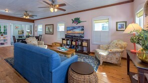 The living room is furnished with old-fashioned, comfortable furniture, but also has a modern large flat screen 'Smart' TV...
