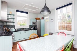 Large open plan kitchen with dining
