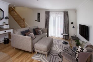 Lounge with french doors leading to parking