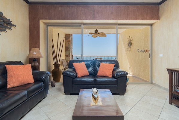 The living room with its dark sofas.