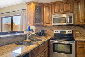 Custom wood cabinetry and countertops in the kitchen.