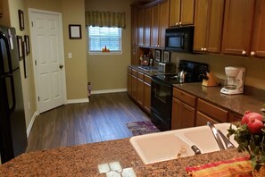 Fully Equipped Kitchen With Keurig Coffee Maker.