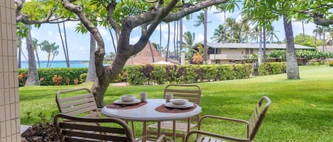 Lanai flows out to grassy area and down to the Gazebo Restaurant and oceanfront pool.