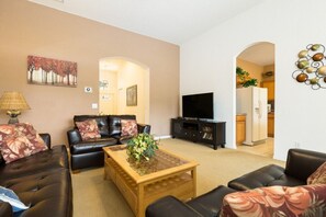 Cozy living room with comfortable seating and entertainment for your downtime.