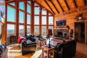 Great room with wood burning fireplace and TV
