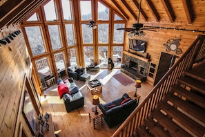 Great room with wood burning fireplace and TV