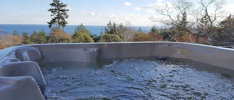 Hot tub overlooks the Juan de Fuca Strait and Olympic Mountains.