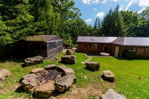 Outdoor fireplace - Spacious and log seats great for groups.