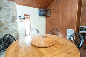 Dining Area - Round table with seating for 6 people.