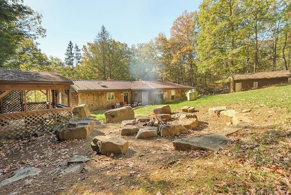 Outdoor fireplace - Spacious and log seats great for groups.