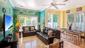 The Smiling Ibis -The living area has bright, tropical colors, tall ceilings, and luxurious modern furnishings...