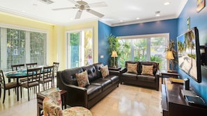 The Contented Crane - The living area has bright, tropical colors, tall ceilings, and luxurious modern furnishings...