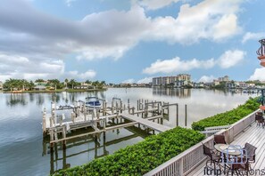 Your own private boat slip located just off the deck with community BBQ grill and outdoor dining area.