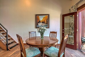 The dining area opens to the private balcony