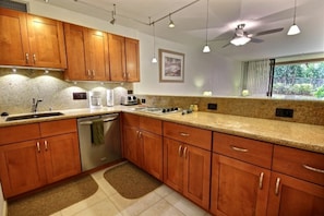 Lovely Kitchen with granite counter tops.