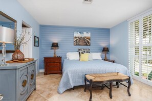Master bedroom with a king bed, en-suite bath and walk-in closet.  Includes a Smart TV
