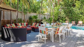 Indulge in a poolside meal at the full outdoor dining set using the deluxe BBQ grill...