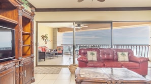 The living room is next to the sliding doors onto the balcony.