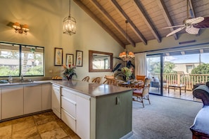 Spacious living area with vaulted ceilings.