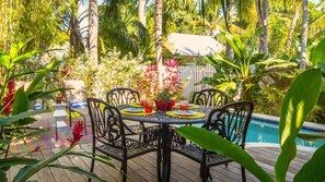 Enjoy a poolside BBQ using the outdoor dining table and propane grill...