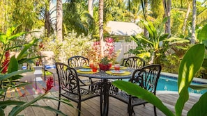 Enjoy a poolside BBQ using the outdoor dining table and propane grill...