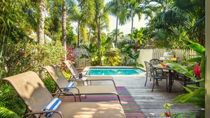 The private dip pool is heat-optional and surrounded by lush landscaping...