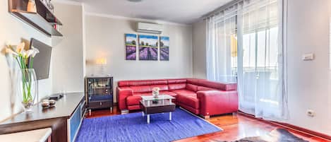 Living room with sofa bed and 40 inch TV