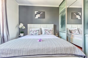 Bedroom 1 with a 160 cm bed and a large wardrobe