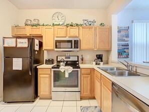 Fully equipped kitchen with modern appliances and plenty of counter space.