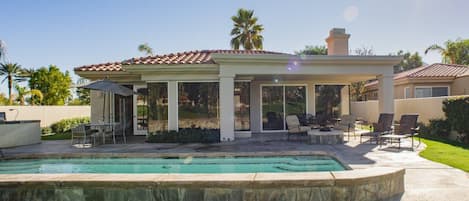 View from Golf Course of back patio, pool, BBQ and Fire Pit