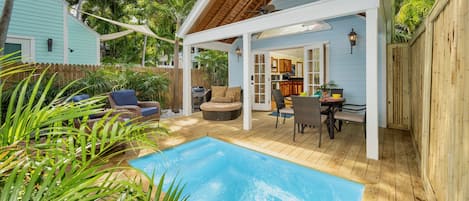 SWEPT AWAY is a meticulously renovated two bedroom home with a mix of classic Key West and a new coastal style...