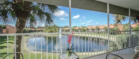 Amazing water feature/fountain views from private screened lanai of this 2nd floor condo!